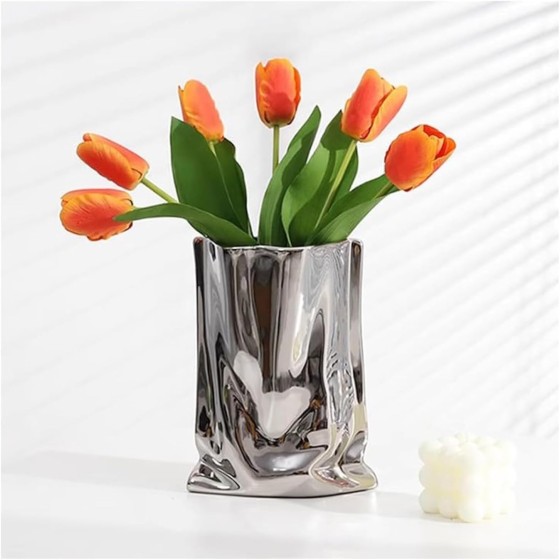 Silver ceramic vase with a pleated paper design—a metallic-finish home decor accent.